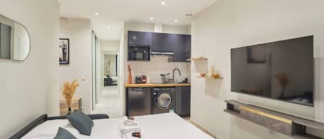 Apartment | Laptop workspace, iron/ironing board, bed sheets