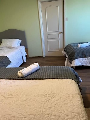 Family Triple Room, City View | Desk, laptop workspace, free WiFi