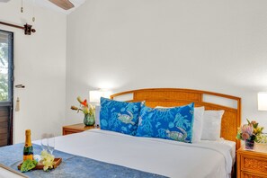 Bright, inviting bedroom with tropical accents and cozy linens for a restful night’s sleep. NAP-C37 - Napili Point | Oceanfront 3 BR, Sleeps 10 | Car Incl. w/ 6+ Nights | NAP ML-1550 by KBM (Lahaina)