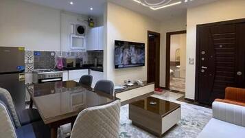 Apartment, 2 Bedrooms | Living area | TV