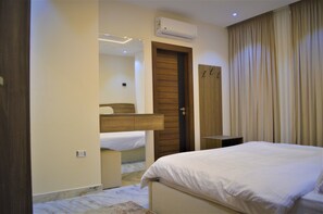 Deluxe Apartment, 3 Bedrooms, City View | In-room safe, desk, laptop workspace, soundproofing