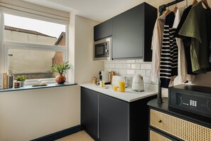 Fridge, microwave, coffee/tea maker, toaster