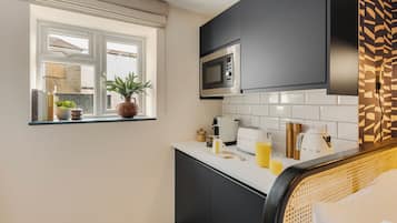 Fridge, microwave, coffee/tea maker, toaster