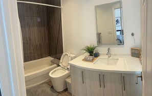 Shower, hair dryer, towels, soap