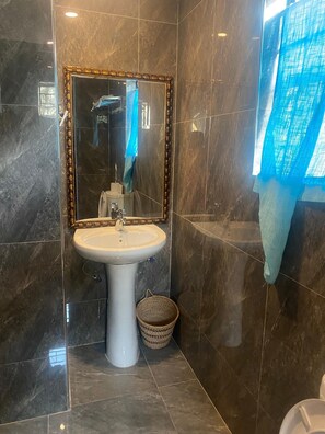 Deluxe House, Lake View | Bathroom | Shower, slippers, towels, soap