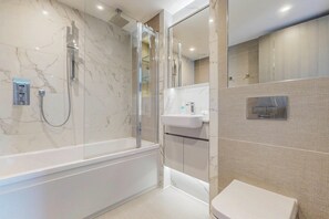 Shower, hair dryer, towels, shampoo