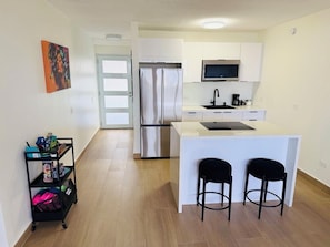 Fridge, microwave, stovetop, coffee/tea maker
