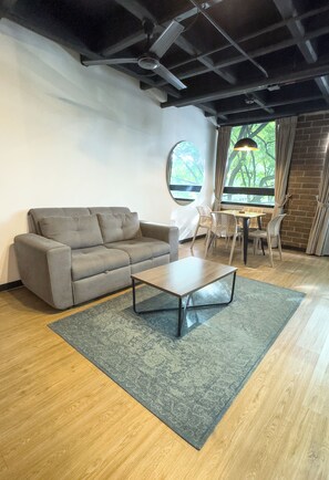 Superior Apartment (302) | Living area | Flat-screen TV - Be Together By Roots Rentals (Medellín)
