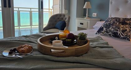 Beachfront house with fantastic views, full kitchen and quality wifi.