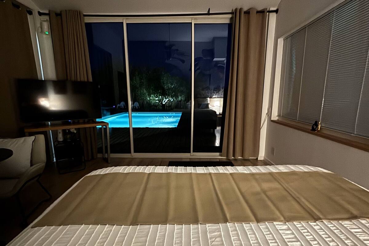 Superior Suite, Pool View | Blackout drapes, soundproofing, iron/ironing board, free WiFi