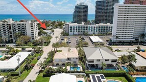 A high-rise hotel with multiple floors, a parking lot, and a view of the ocean. - 2237/U1-Top Pick-Beachfront-Downtown (Fort Lauderdale)