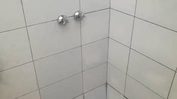 Shower, slippers, soap, toilet paper