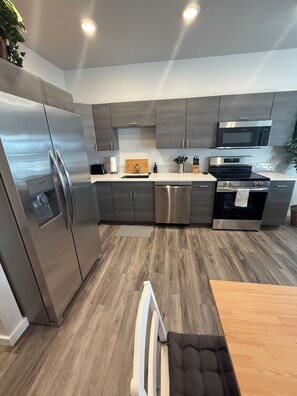 Fridge, microwave, oven, stovetop - Brand new construction, stylish 3BR/2BA apartment in Laramie 1 blk from campus (Laramie)