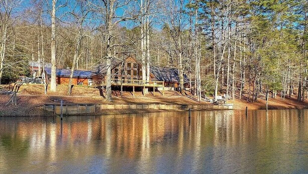 A cabin by a lake surrounded by trees. - Willow Falls (Blue Ridge)