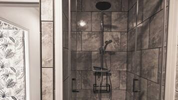 Shower, hair dryer, towels, toilet paper