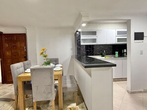 Fridge, microwave, stovetop, coffee/tea maker