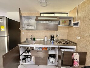 Fridge, microwave, stovetop, coffee/tea maker