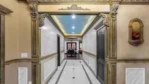 A hallway with ornate gold detailing, a marble floor, and a ceiling with a skylight. - Stunning Roman Design 7bed5bath in Heart San Jose (San Jose)
