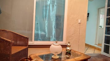 Deluxe Studio Suite, Garden View | Living area | 30-inch Smart TV with cable channels