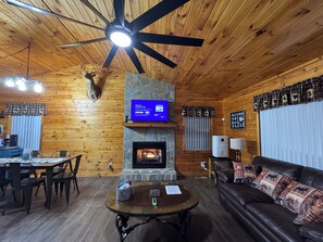 Smart TV, fireplace, table football, books