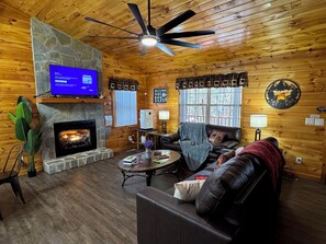Smart TV, fireplace, table football, books