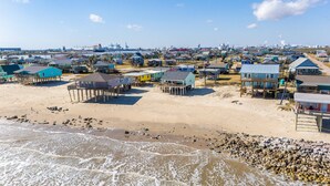 A coastal area with beach houses and a marina. - Prime | Beachfront | Beach Access | Sleeps 8 (Surfside Beach)