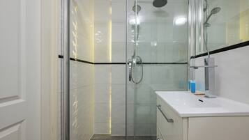 Shower, hair dryer, towels, soap