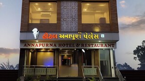 A multi-story hotel with a prominent sign reading "ANNAPURNA HOTEL & RESTAURANT."