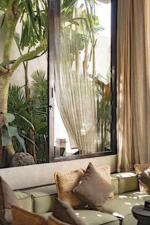 Luxury Villa, 1 Bedroom, Patio, Pool View | Living room | 55-inch TV with cable channels