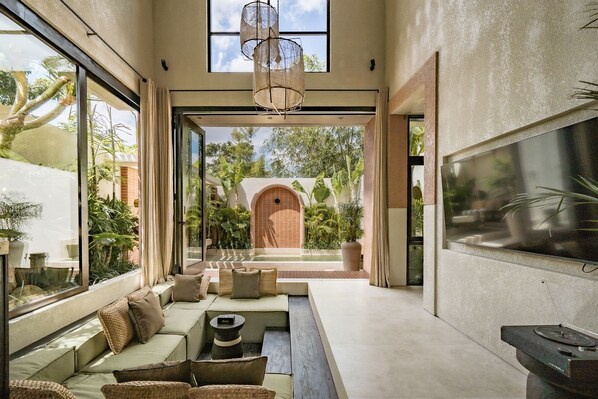 Luxury Villa, 1 Bedroom, Patio, Pool View | Living area | 55-inch TV with cable channels