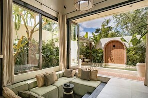 Luxury Villa, 1 Bedroom, Patio, Pool View | Living area | 55-inch TV with cable channels