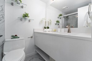Shower, hair dryer, towels, soap