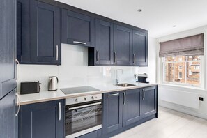 Fridge, microwave, oven, cookware/dishes/utensils