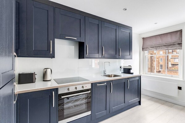 Fridge, microwave, oven, cookware/dishes/utensils