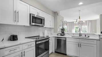 Fridge, microwave, oven, cookware/dishes/utensils