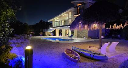 Four-bedroom beach house with oceanfront pool and smokeless bonfire area