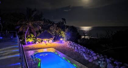 Four-bedroom beach house with oceanfront pool and smokeless bonfire area