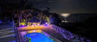 Four-bedroom beach house with oceanfront pool and smokeless bonfire area