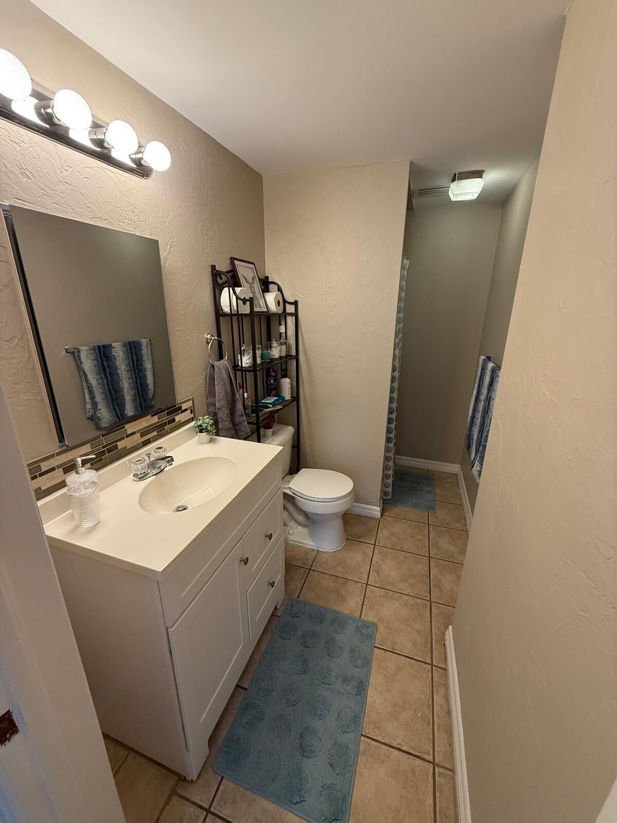 Shower, hair dryer, towels, toilet paper