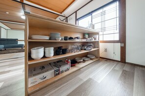 Full-size fridge, microwave, stovetop, cookware/dishes/utensils