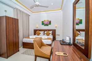 Deluxe Double Room, Balcony, City View | Desk, laptop workspace, soundproofing, iron/ironing board