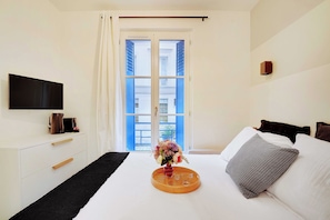 Apartment | Laptop workspace, iron/ironing board, bed sheets