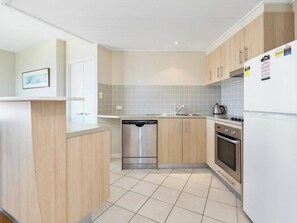 Microwave, stovetop, dishwasher, dining tables