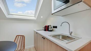 Apartment | Private kitchen | Fridge, microwave, stovetop, coffee/tea maker