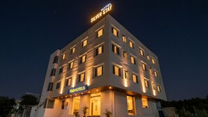 A multi-story hotel with a sign reading "Hotel Silver Stay" and "FabHotels" on the ground floor. - Fabhotel Cozzy Stay (Jaipur)