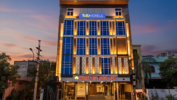 A multi-story building with a sign reading "faabHOTELS" and "HOTEL TIP TOP PLAZA". - Fabhotel Tip Top (Jaipur)