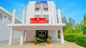 A hotel entrance with a sign reading "HOTEL ANANT" and a contact number. - Fabhotel Anant (Lucknow)
