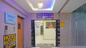 The entrance to Hotel K. Rajtilak with signs indicating A/C rooms on the 1st floor. - Fabhotel Rajtilak (Ahmedabad)