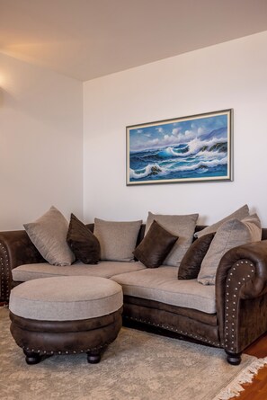 Luxury Apartment | Living area | 36-inch flat-screen TV with cable channels