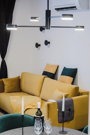 Apartment | Living area | 30-inch flat-screen TV with cable channels